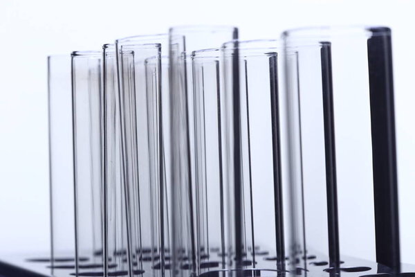 Abstract Group of Glass Tube Empty Laboratory on Stainless Steel Stand, studio llighting white background isolated copy space, closeup
