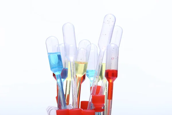 Red Blue Yellow Liquid Dropper Glass Many Tube Studio Lighting — Stock Photo, Image