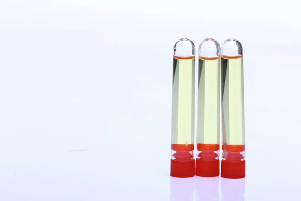 Yelllow Liquid Group Three Glass Tube Red Cap Lab Test — Stock Photo, Image
