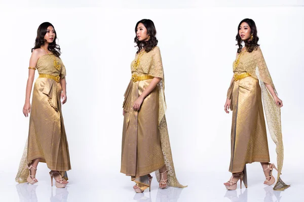 タイの黄金のドレス伝統衣装や東南アジアの金のドレスアジアの女性で装飾ウォークで多くのポーズでコラージュグループパックスタジオの下に白の背景は完全に隔離された長さ — ストック写真