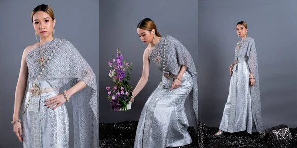 Blue Silver Dress of Thai Traditional Costume or South East Asia gold in Asian Woman with decoration hold flower portrait in many poses under Studio lighting grey background, collage group pack
