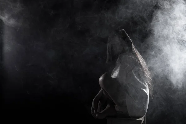 White Smoke Tan Skin Asian Woman black straight hair with business shirt on chair, Abstract high low exposure contrast, copy space for text logo, broken heart lonely girl can cry