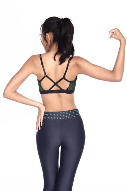 Bronz tenli, Asyalı güzel spor kızı seksi, spor, yeşil sütyen mavisi taytlı, 