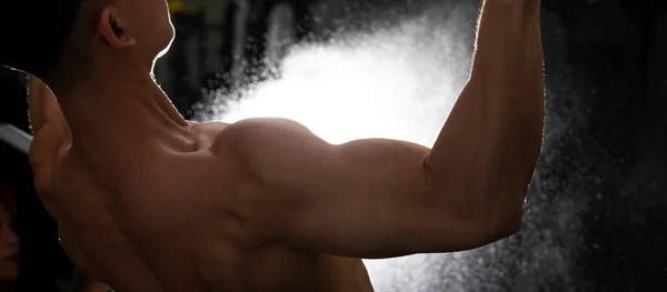 Back side view of Asian Muscular Fitness Man black hair exercise warm up body on Pull