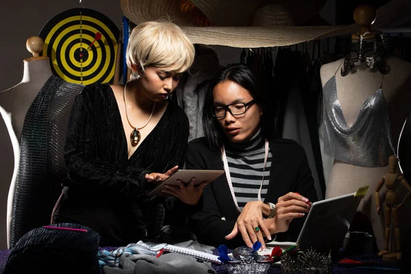 Duo Tomboy blonde hair, Ladyboy black long Fashion Designers check pattern design on notebook paper. LBGT Transgender tailor styling new trend of online store shop and social media. Dartboard target