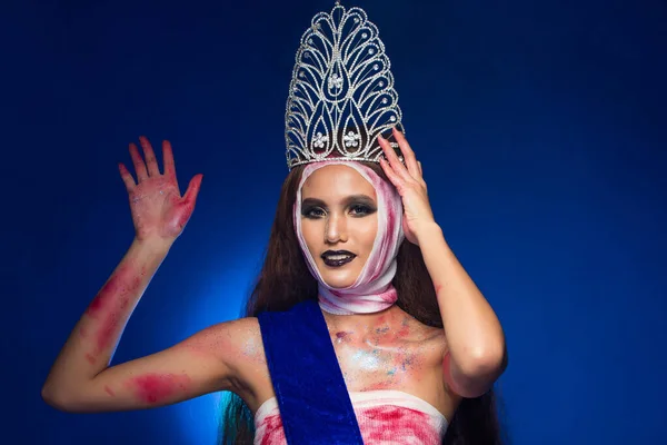 Miss Beauty Pageant contest Diamond Crown Sash want to be Most Beautiful in the World Universe by operating Plastic Surgery all Face head nose chin and blood glitter bandage, pain for good winner