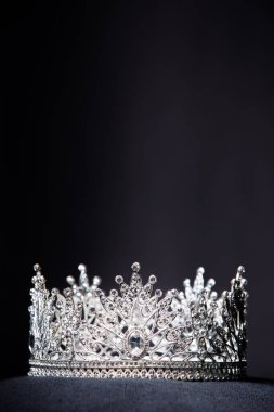 Diamond Silver Crown for Miss Pageant Beauty Contest, Crystal Tiara jewelry decorated gems stone and abstract dark background on black velvet fabric cloth, Macro photography copy space for text logo