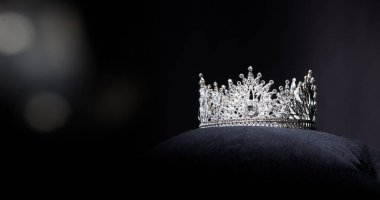 Diamond Silver Crown for Miss Pageant Beauty Contest, Crystal Tiara jewelry decorated gems stone and abstract dark background on black velvet fabric cloth, Macro photography copy space for text logo