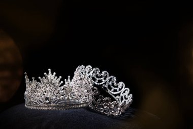 Diamond Silver Crown for Miss Pageant Beauty Contest, Crystal Tiara jewelry decorated gems stone and abstract dark background on black velvet fabric cloth, Macro photography copy space for text logo