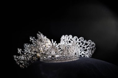 Diamond Silver Crown for Miss Pageant Beauty Contest, Crystal Tiara jewelry decorated gems stone and abstract dark background on black velvet fabric cloth, Macro photography copy space for text logo
