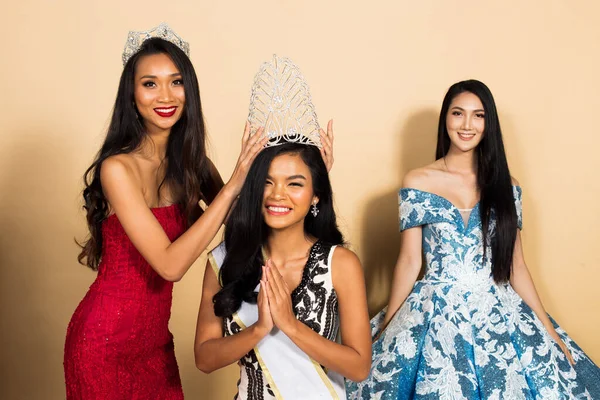 Group of Three Miss Beauty Pageant Queen Contest in Asian Evening Ball Gown sequin dress with Diamond Crown Sash, final moment of waiting putting down Crown to winner session and multi national race