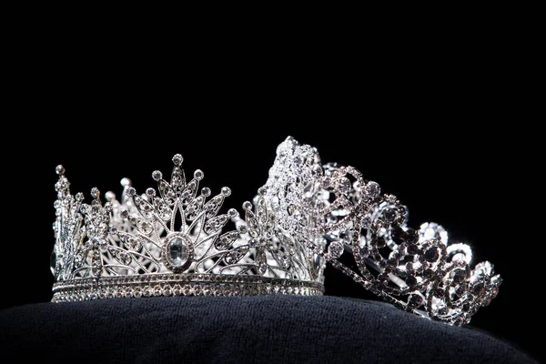 Diamond Silver Crown for Miss Pageant Beauty Contest, Crystal Tiara jewelry decorated gems stone and abstract dark background on black velvet fabric cloth, Macro photography copy space for text logo