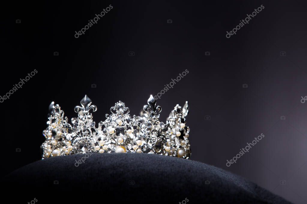 Diamond Silver Crown for Miss Pageant Beauty Contest, Crystal Tiara jewelry decorated gems stone and abstract dark background on black velvet fabric cloth, Macro photography copy space for text logo