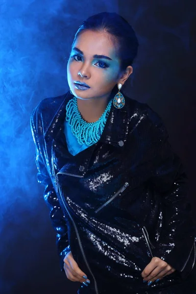 Black Sequin Jacket on Blue Fashion Make Up Asian Beautiful Models black hair, studio lighting dark background smoke copy space