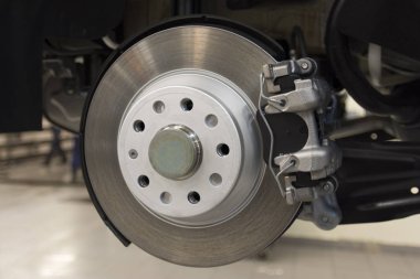 Car brake caliper close-up. Rear brakes of a modern car. technical photography.