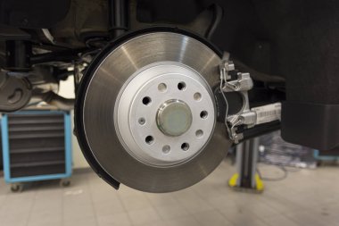 Car brake caliper close-up. Rear brakes of a modern car. technical photography.