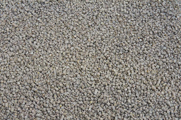 Granules of animal feed close up. Background image of chicken feed