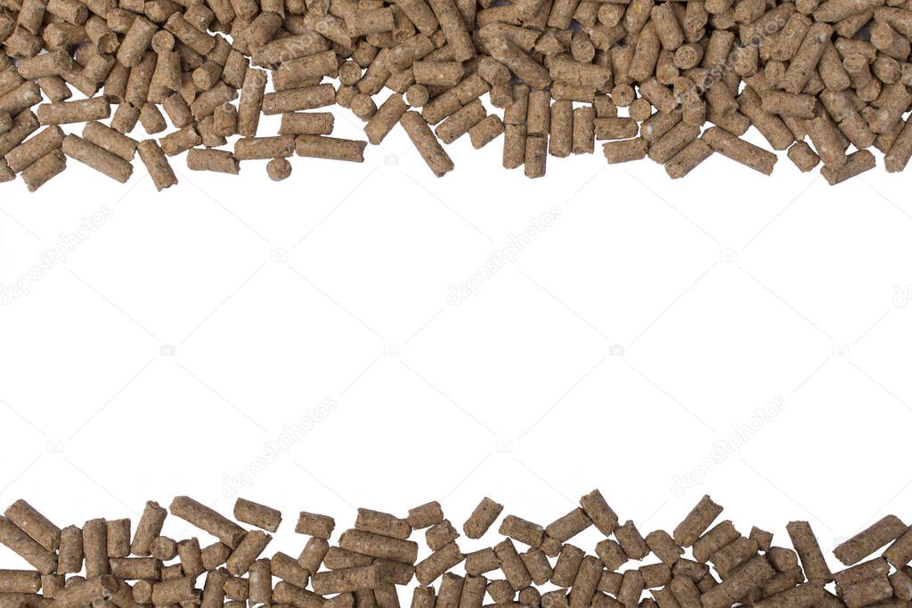 Granules of animal feed close up. Background texture isolated