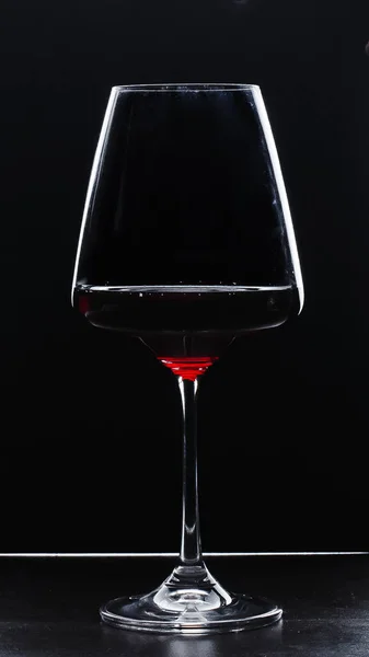 a glass of red wine and a place for text