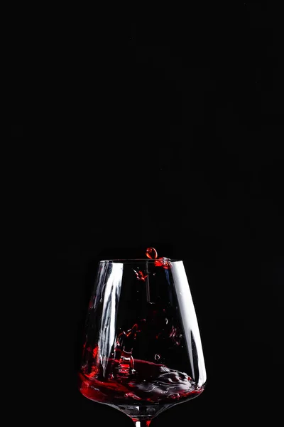 a glass of red wine and a place for text