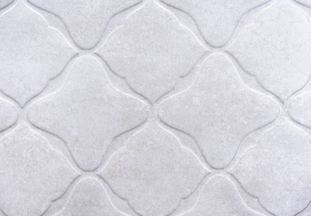 White embossed porcelain stoneware. Background and texture of porcelain tiles.