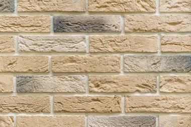 Bej tuğlalardan bir duvar. Tuğla işçiliğinin arkaplan ve dokusu.