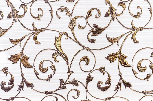 White porcelain tiles with a gold floral ornament. Ceramic tiles with volumetric golden pattern. — Stock Photo, Image