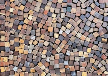 Wooden cubes of different colors. Volumetric wooden texture.