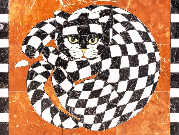 Cat from of black and white pieces of marble. Chess cat on an orange background.