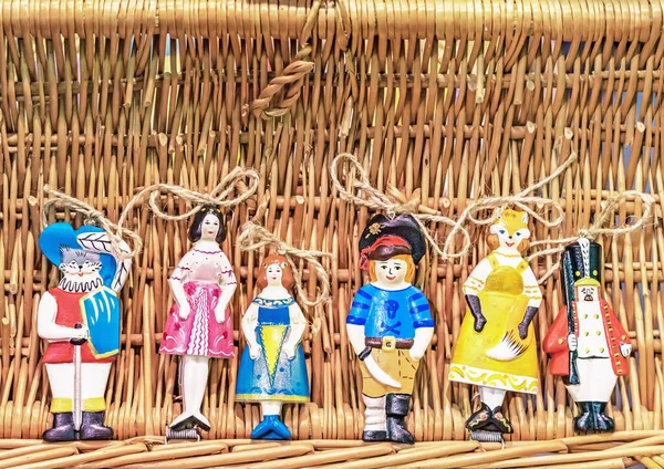 Ceramic Toys Fairy Tale Characters Background Wicker Basket — Stock Photo, Image