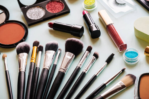 Brush and cosmetic isolated on a white background. Top view.