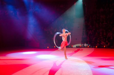 Moscow Circus on Ice on tour. Game with hula hoops clipart