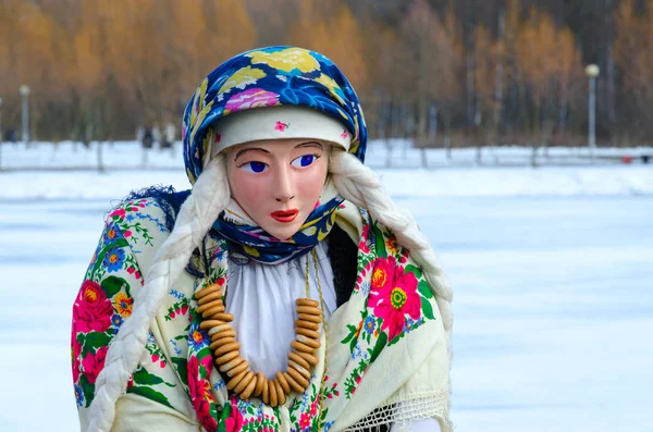 Shrovetide doll in colorful shawls, shirt and fur sleeveless jacket — Stock Photo, Image