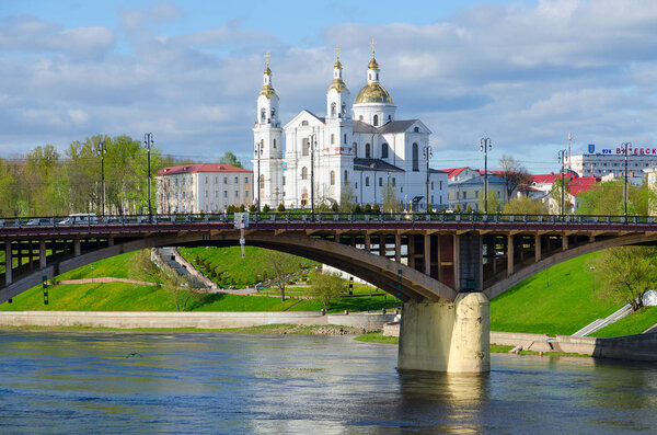 Beautiful view of Holy Dormition Cathedral and Kirovsky Bridge across Western Dvina River, Vitebsk, Belarus