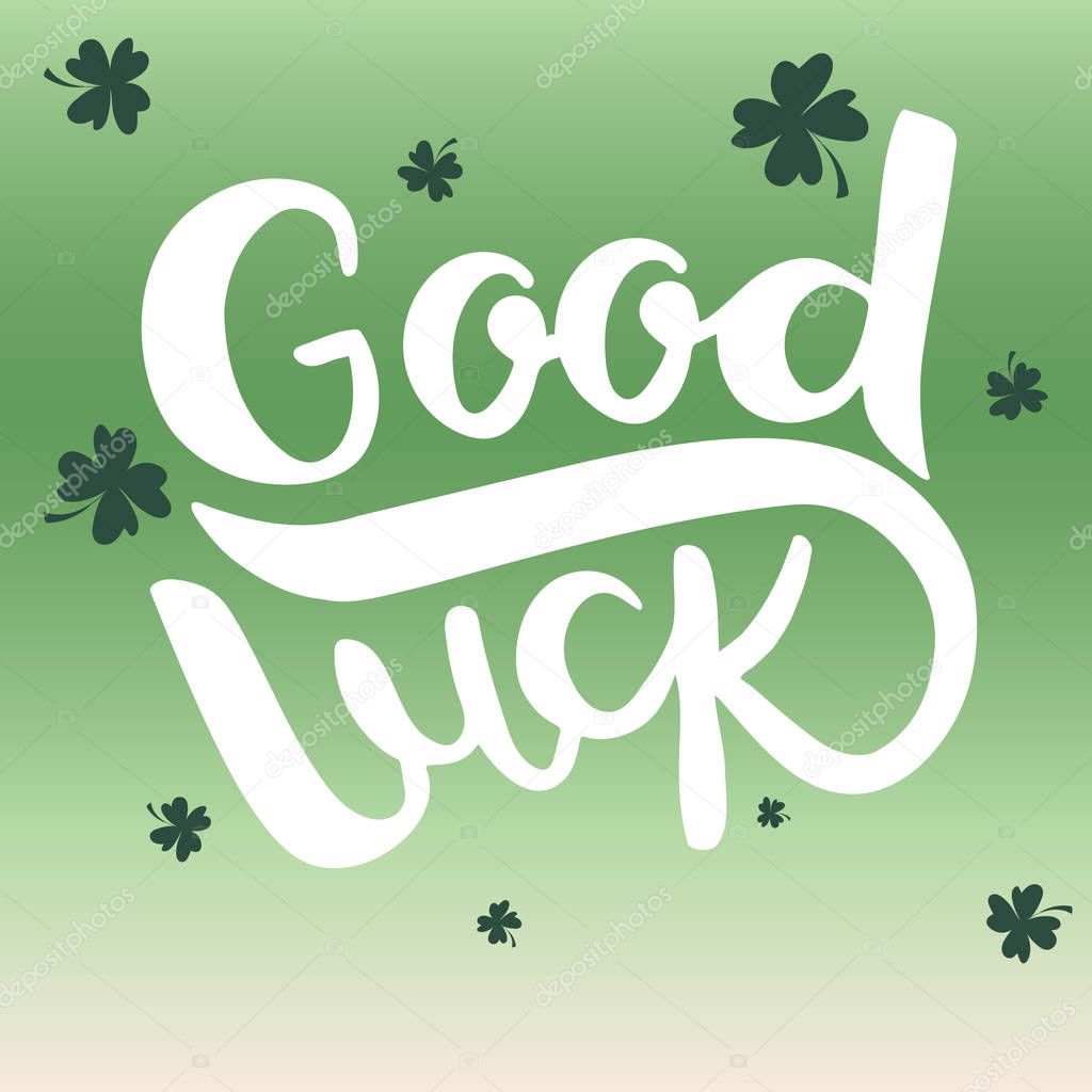 Good luck lettering on green gradient background with clover.