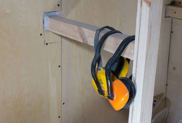 protective earphones for safe operation of the tool on the construction site
