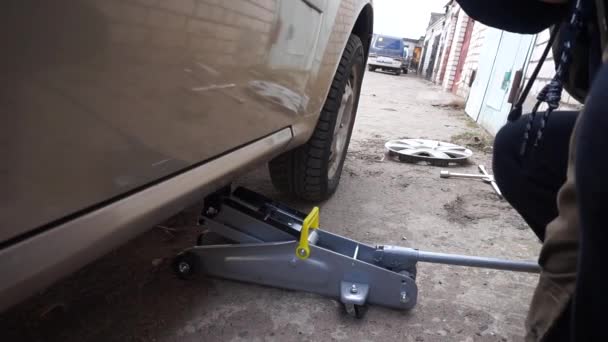 Replacing Wheel Car Lifting Car Jack — Stock Video