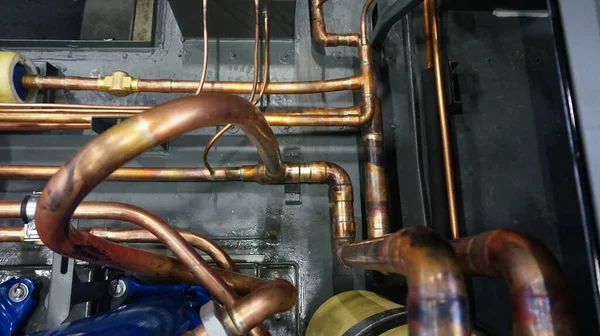 cooling circuit made of copper pipes. Assembly of industrial air conditioners and refrigeration equipment