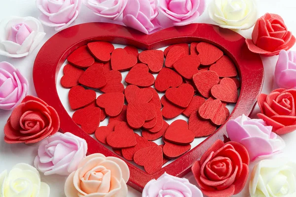 A lot of red hearts and decorative flowers. Stock Image