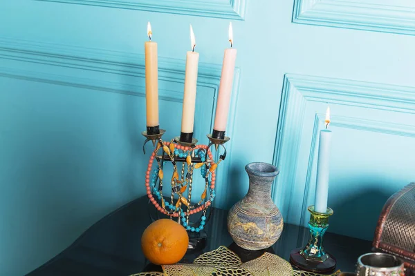 A candlestick with a jug is on the table. — Stock Photo, Image