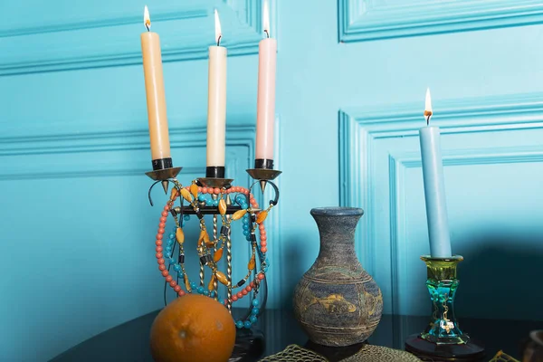 A candlestick with a jug is on the table. — Stock Photo, Image