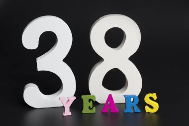 Letters and numbers thirty-eight years on a black background. clipart