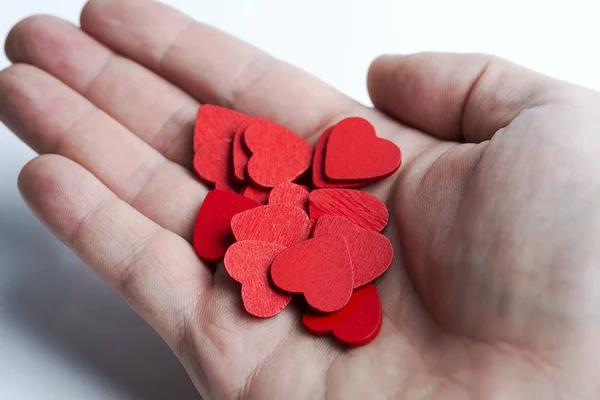 I hand massa röda hjärtan. — Stockfoto