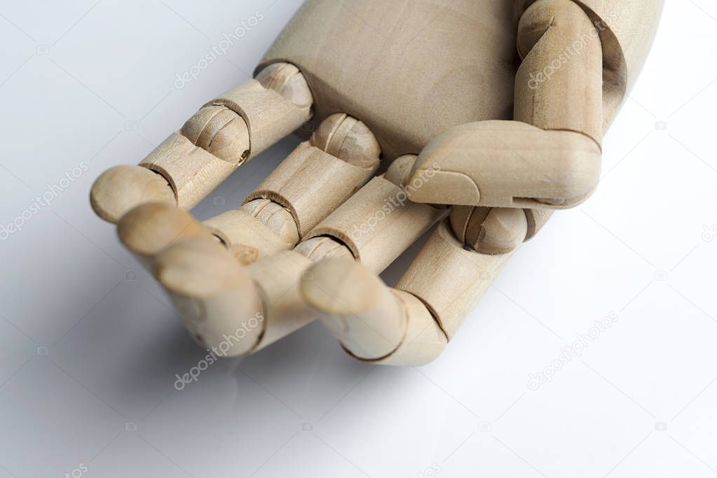 Wooden hand on a white background.
