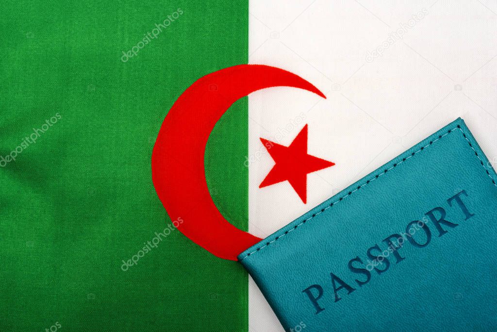 On the background of the flag of Algeria is a passport.