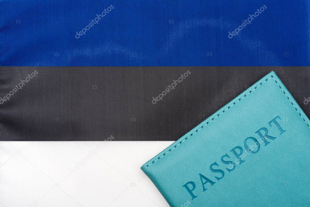 On the background of the flag of Estonia is a passport.