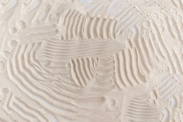 background drawing on natural sand in the sandbox