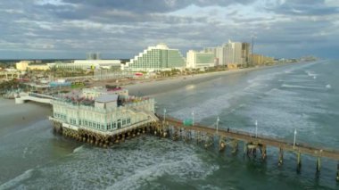 aerial drone shot of daytona beach amusement pier ocean