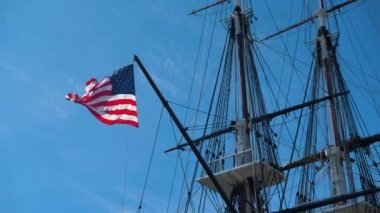 american flag on uss constitution in boston harbor
