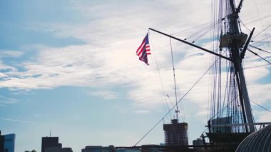 american flag waving on historic military ship uss constitution slow motion